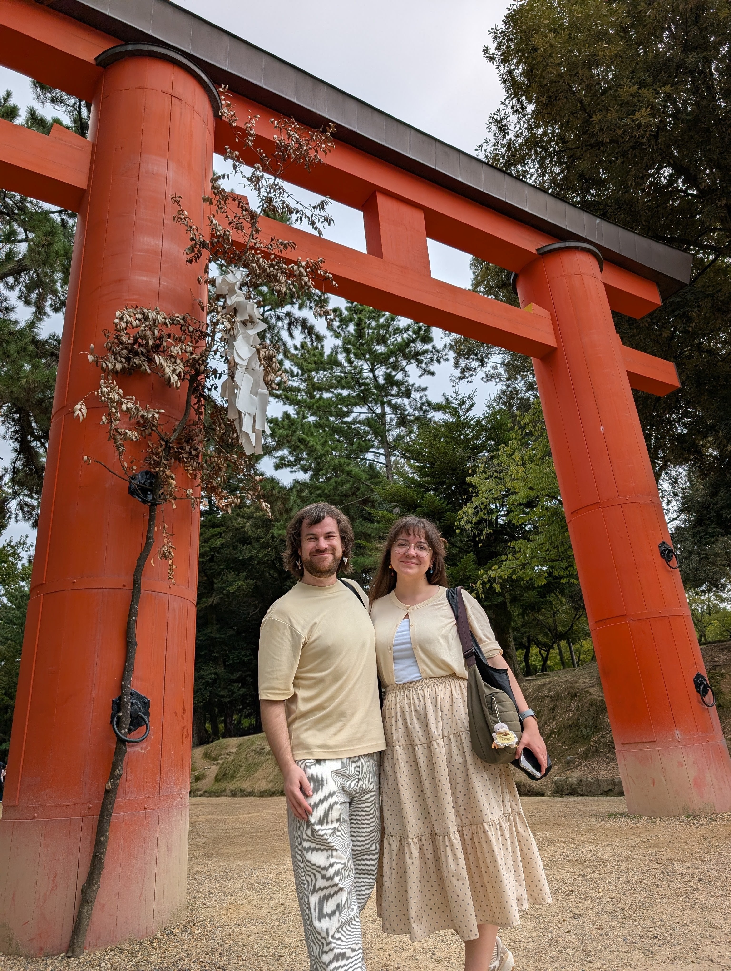 in front of a tori gate in nara japan